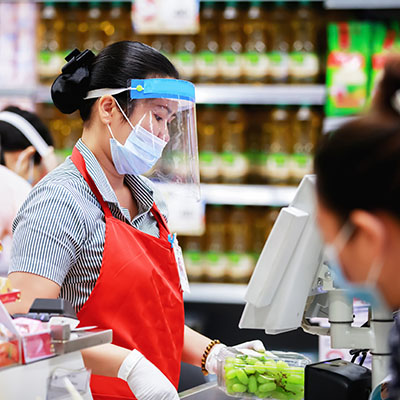 retail cashier wearing a face shield